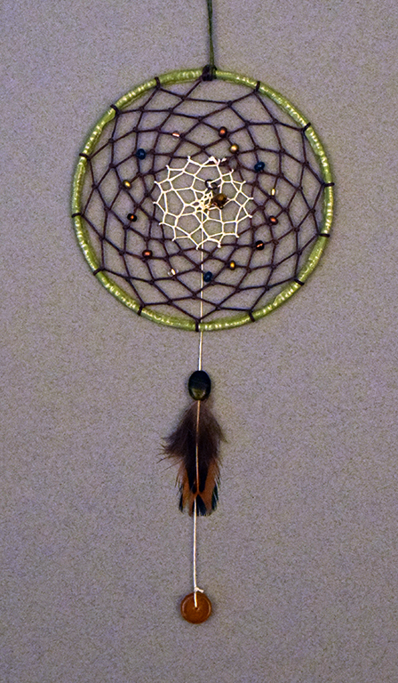 Duo-tone dreamcatcher, washi tape, beads and feather, 2015.