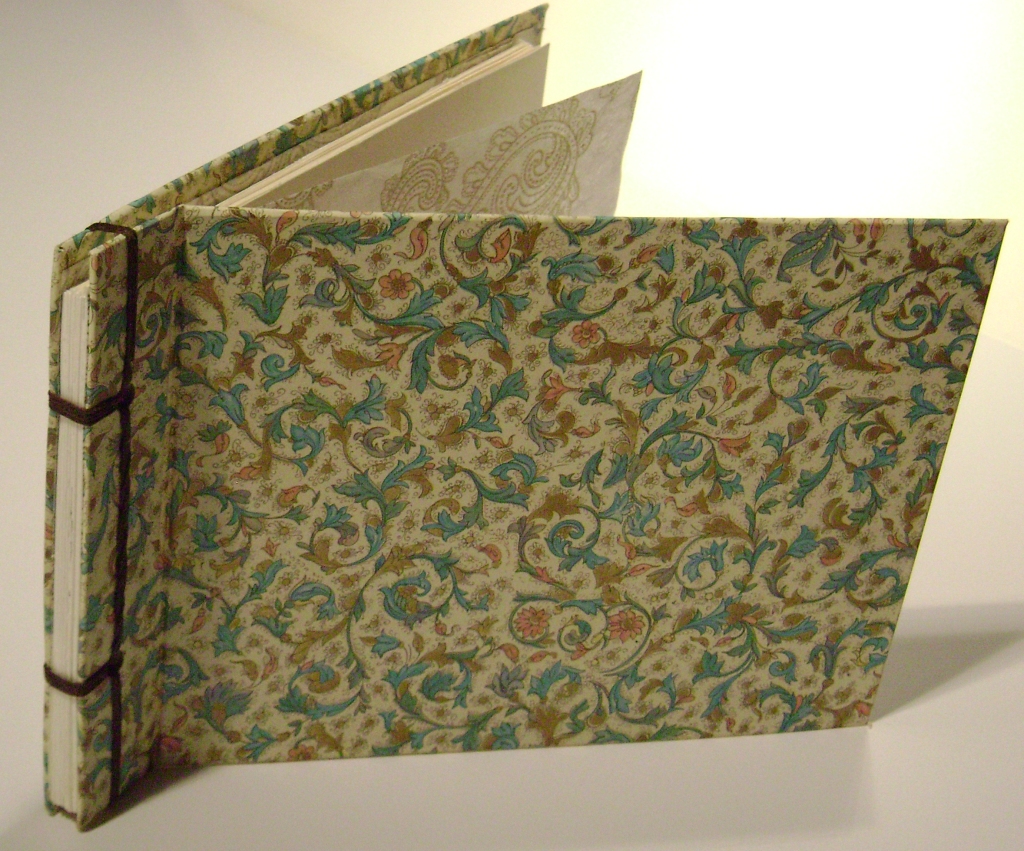 stab-binding with expandable spine, fine and handmade papers, waxed cord and photos; 2007.